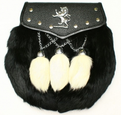 Leather flap with bound edge and studs with metal Lion Rampant Opens and closes with a stud  Black Rabbit fur front with 3 white rabbit tassles on V chains